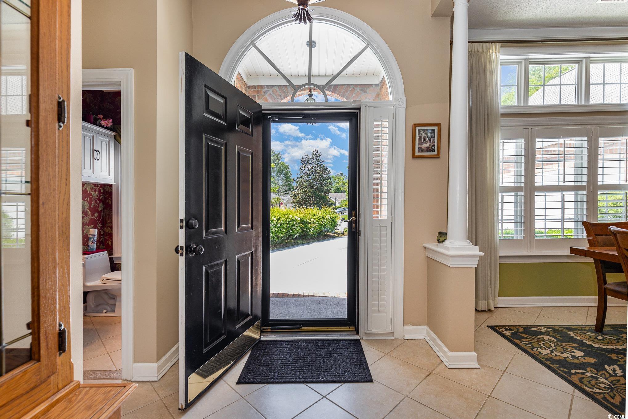 1004 Addington Court Murrells Inlet, SC 29576 - Photo 3 of 40 Entryway featuring decorative columns, light tile patterned floors, and plenty of natural light