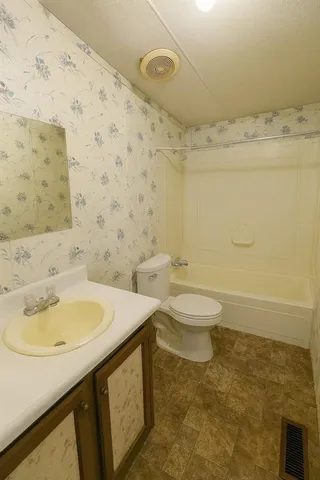 a bathroom with a sink and a toilet
