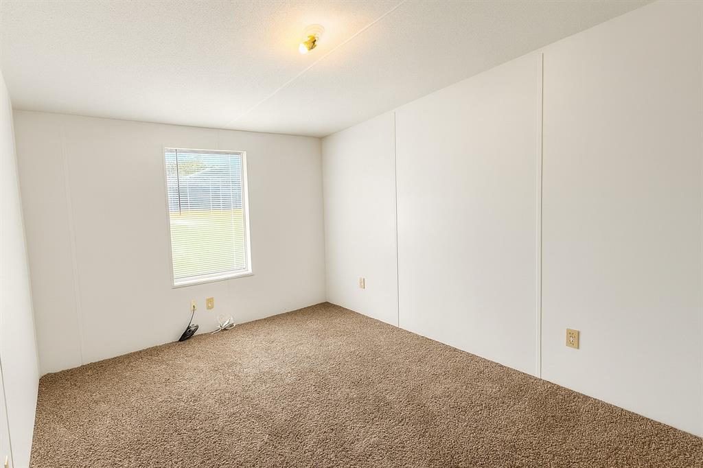 398 Avenue D Point, TX 75472 - Photo 10 of 11 a view of an empty room with a window