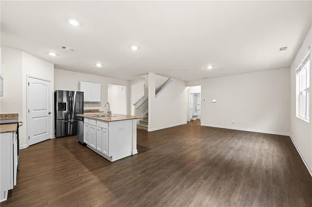 a view of kitchen with wooden floor
