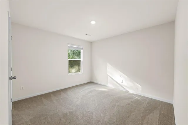 a bathroom with a toilet and a tub