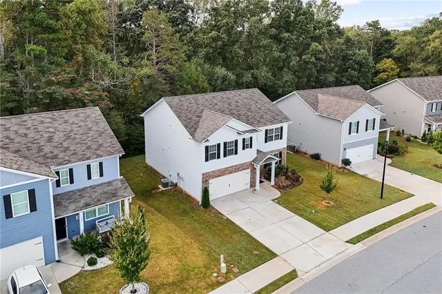 an aerial view of a house with swimming pool