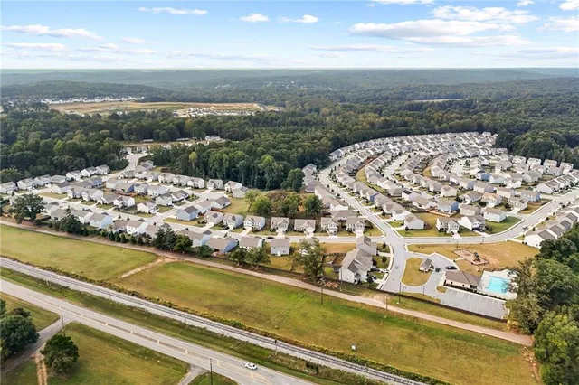 a view of a park with large trees