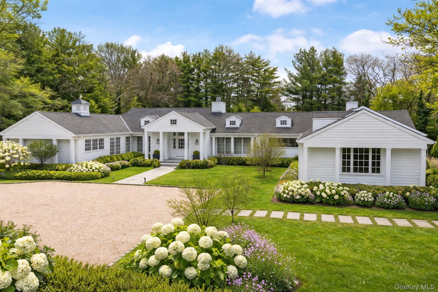 3 Horseshoe Road Old Westbury, NY 11568 - Photo 1 of 1 Front of property featuring stone driveway and bluestone walkway (digitally enhanced photo to resemble Summer)