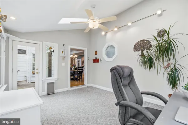 a view of a hallway with closet and entryway