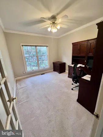 a spacious bedroom with a bed and a chandelier