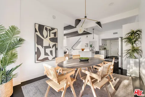 a view of a living room and dining room