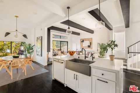 a view of living room with furniture and floor to ceiling window