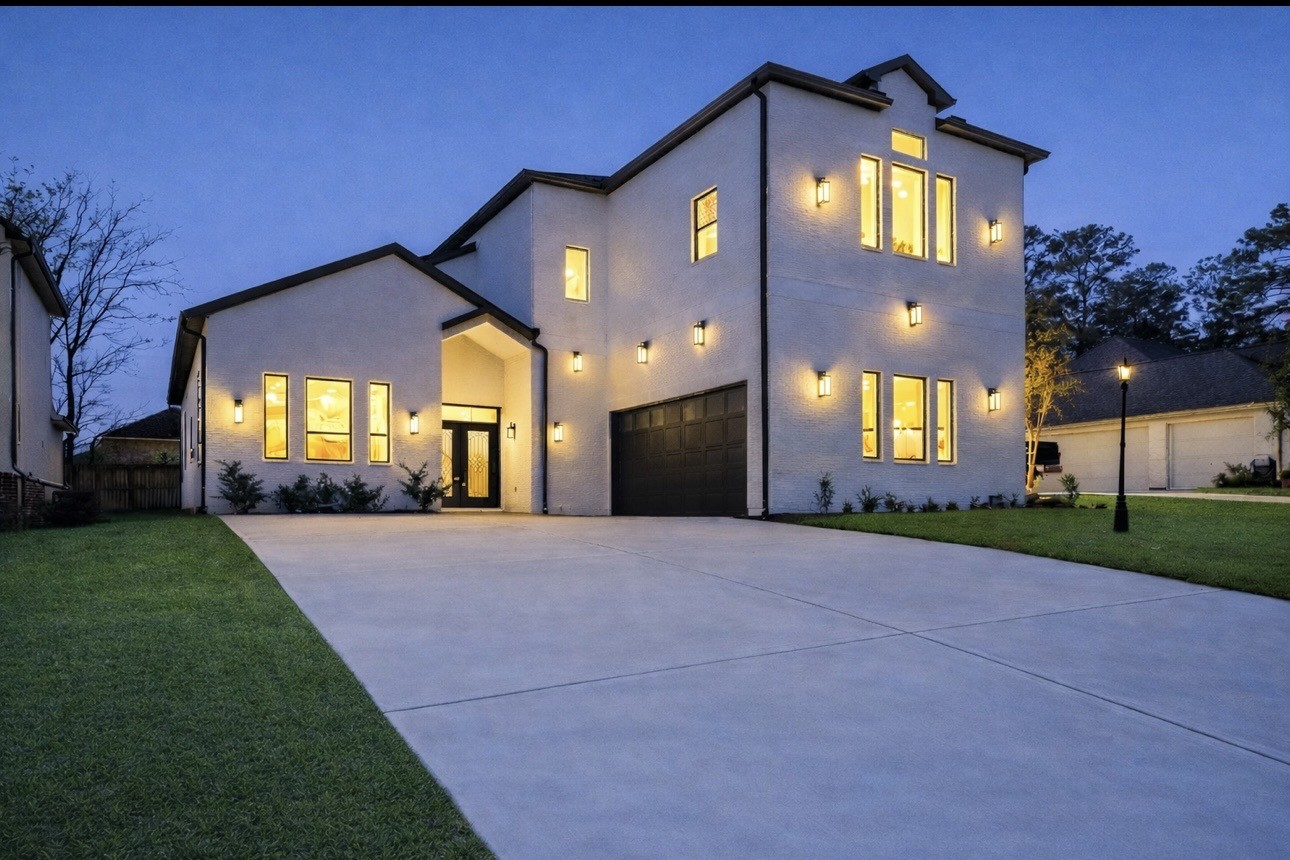 75 Wick Willow Road Montgomery, TX 77356 - Photo 5 of 46 a front view of a house with a yard and garage