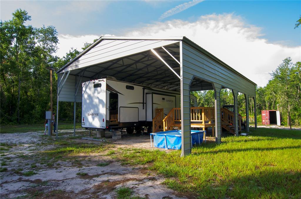 18233 185th Road Live Oak, FL 32060 - Photo 32 of 99 a view of a house with backyard and porch