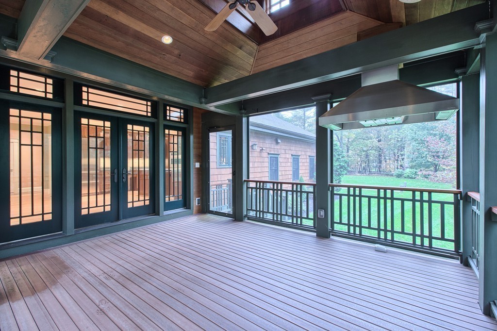21 Valley Road Boxford, MA 01921 - Photo 15 of 28 a view of a porch with wooden floor and floor to ceiling window
