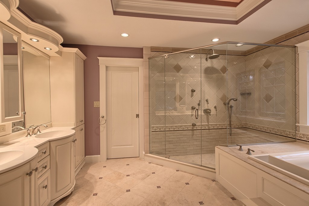 21 Valley Road Boxford, MA 01921 - Photo 21 of 28 a bathroom with a shower sink and mirror