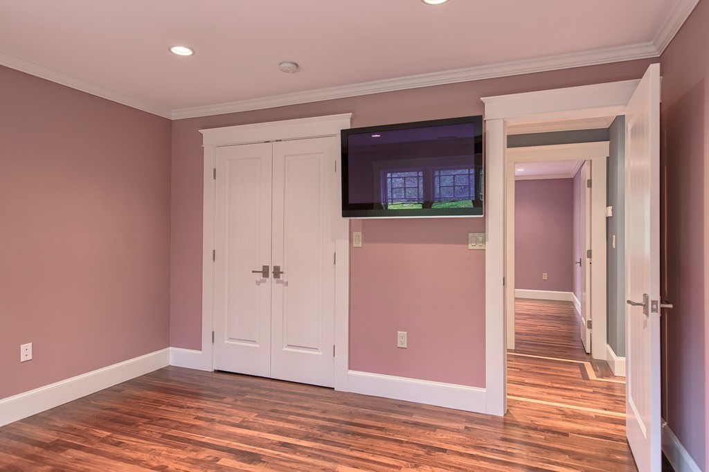 21 Valley Road Boxford, MA 01921 - Photo 24 of 28 a view of a hallway with wooden floor and closet