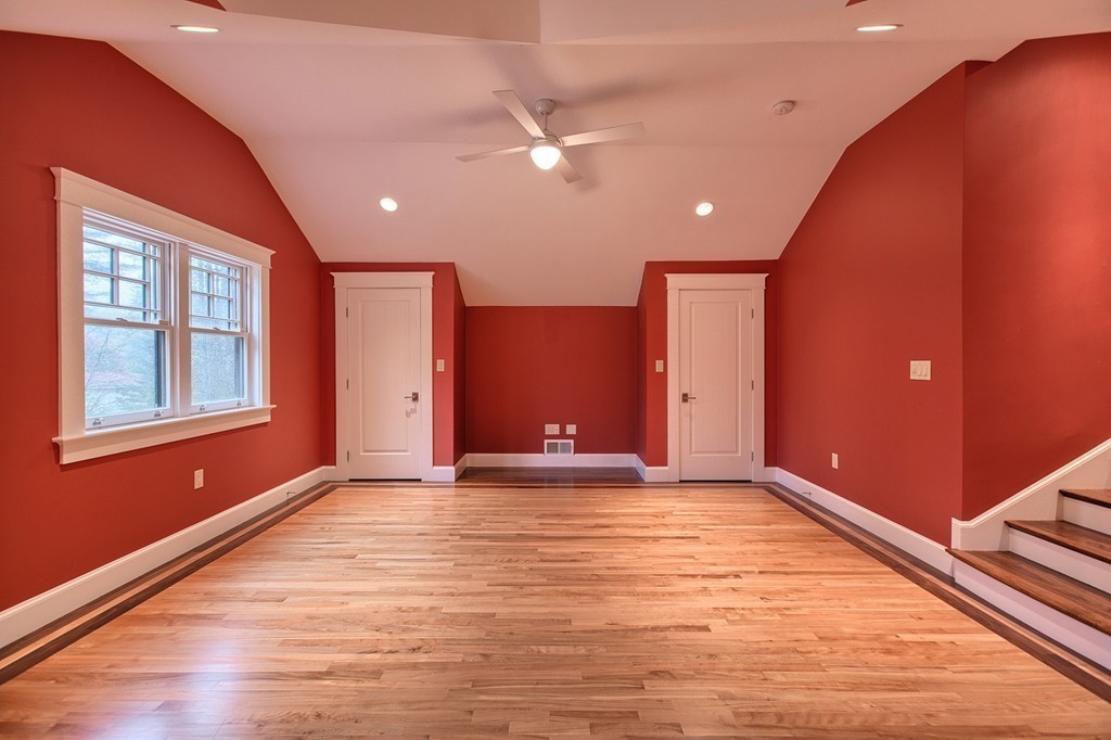 21 Valley Road Boxford, MA 01921 - Photo 26 of 28 a view of an empty room with window and wooden floor