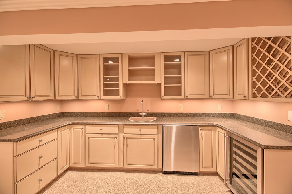 21 Valley Road Boxford, MA 01921 - Photo 28 of 28 a kitchen with granite countertop white cabinets and sink