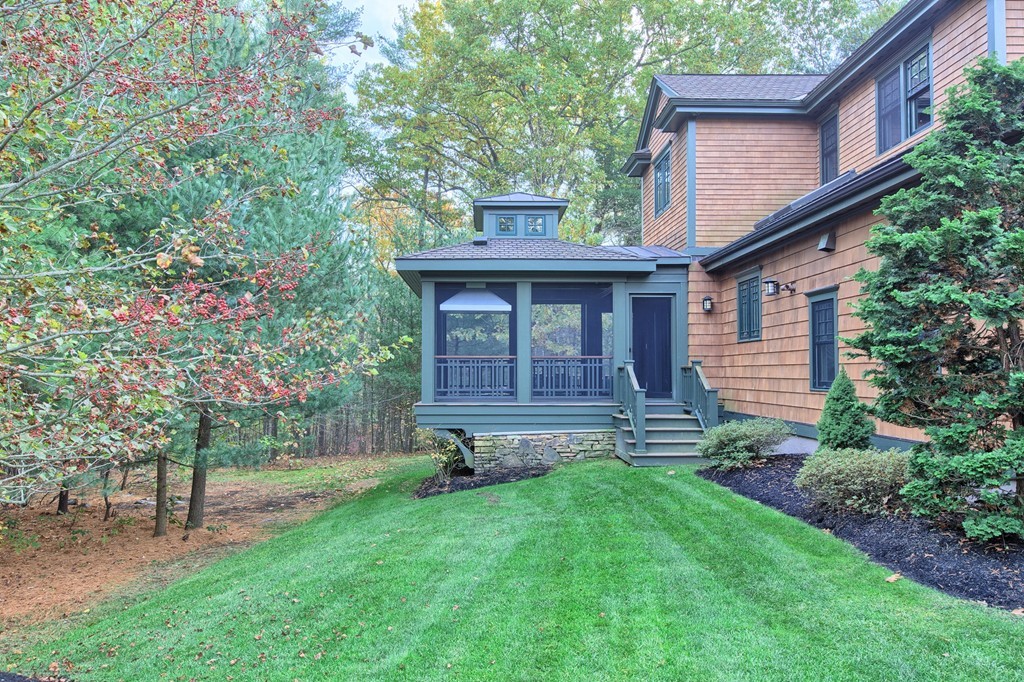 21 Valley Road Boxford, MA 01921 - Photo 3 of 28 a view of a backyard with potted plants and large tree