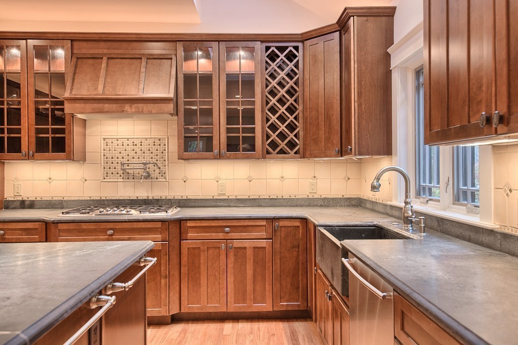21 Valley Road Boxford, MA 01921 - Photo 10 of 28 a kitchen with stainless steel appliances granite countertop a sink and a stove