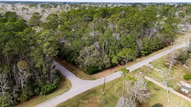a view of a house with a tree