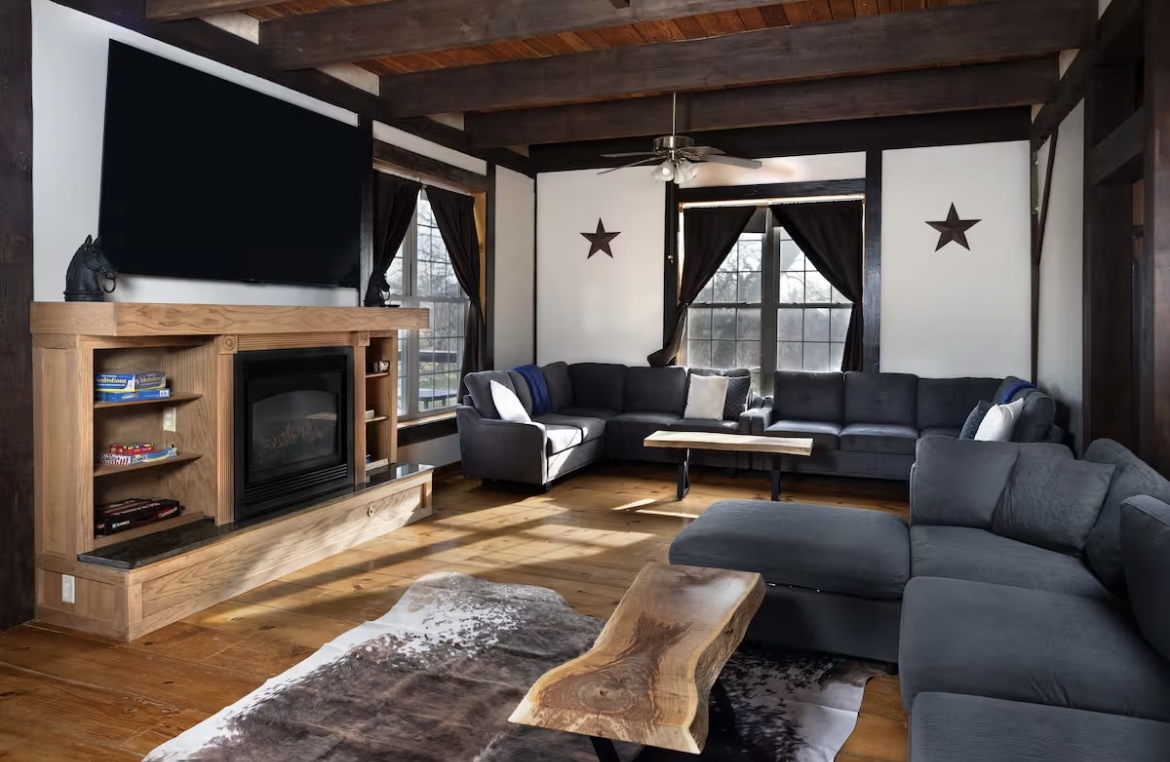 9439 Corneils Road Bristol, IL 60512 - Photo 13 of 44 a living room with furniture a flat screen tv and a fireplace