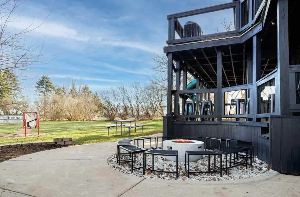 9439 Corneils Road Bristol, IL 60512 - Photo 20 of 44 a view of a patio with a table and chairs