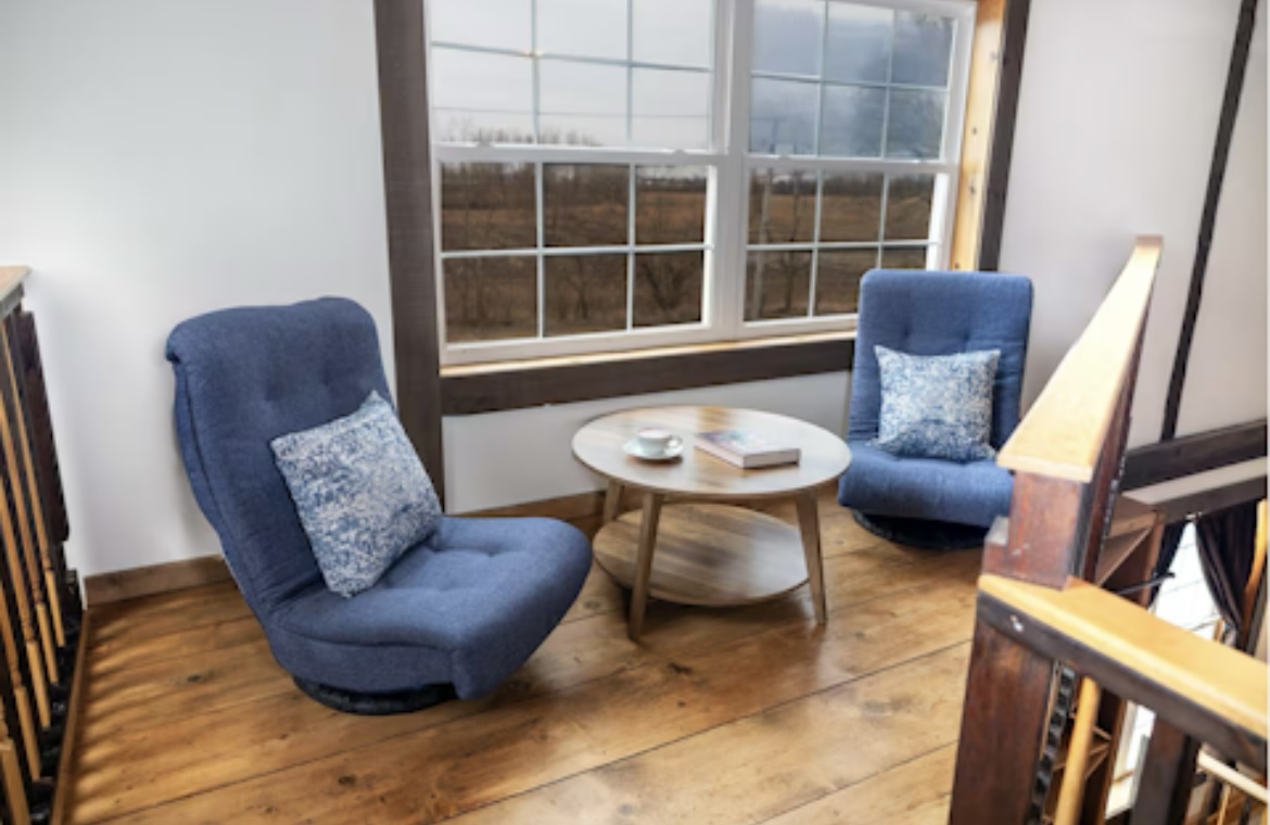 9439 Corneils Road Bristol, IL 60512 - Photo 26 of 44 a living room with furniture and a large window