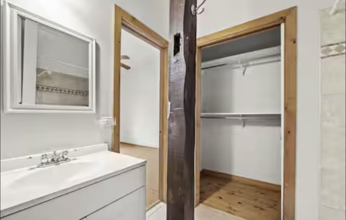 9439 Corneils Road Bristol, IL 60512 - Photo 27 of 44 a bathroom with a sink and a mirror