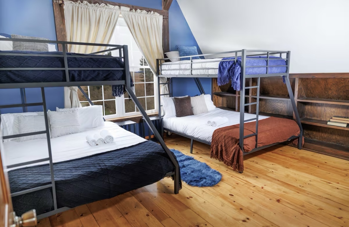 9439 Corneils Road Bristol, IL 60512 - Photo 31 of 44 a bedroom with bed and wooden floor