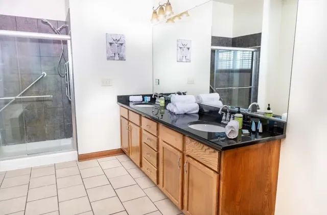 a bathroom with a sink a vanity and a mirror
