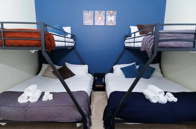 a bedroom with a bed and a mirror