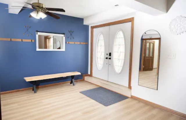 a room with stairs and wooden floor