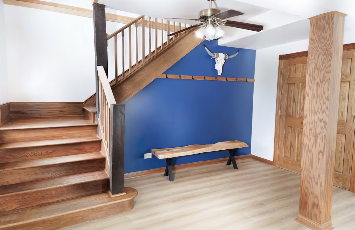 9439 Corneils Road Bristol, IL 60512 - Photo 7 of 44 a room with stairs and wooden floor