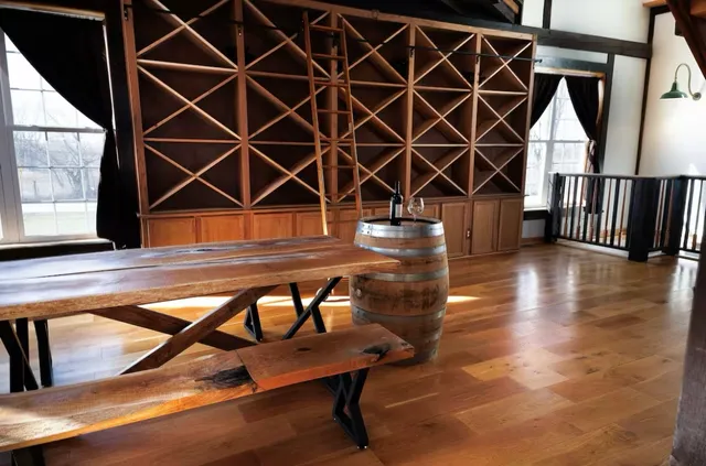 a bedroom with table and chairs