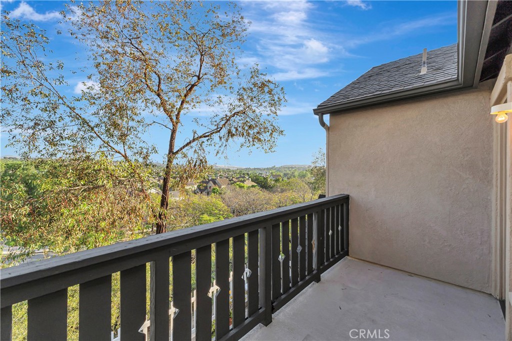 40 Three Vines Court Ladera Ranch, CA 92694 - Photo 12 of 28 a view of a balcony with wooden fence
