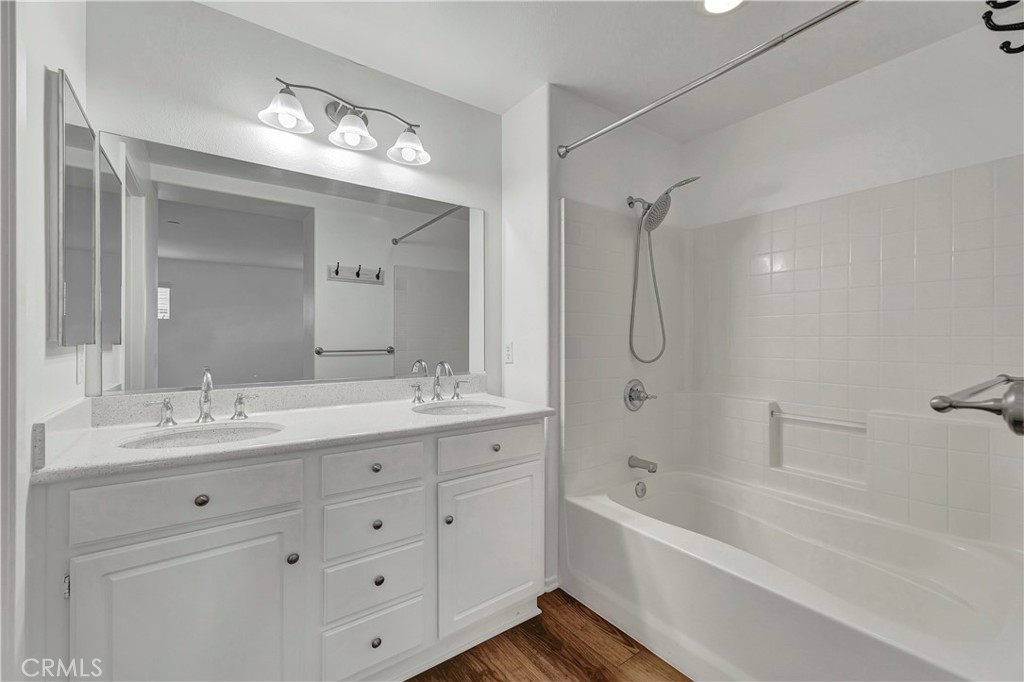 40 Three Vines Court Ladera Ranch, CA 92694 - Photo 21 of 28 a bathroom with a double vanity sink mirror double and bathtub