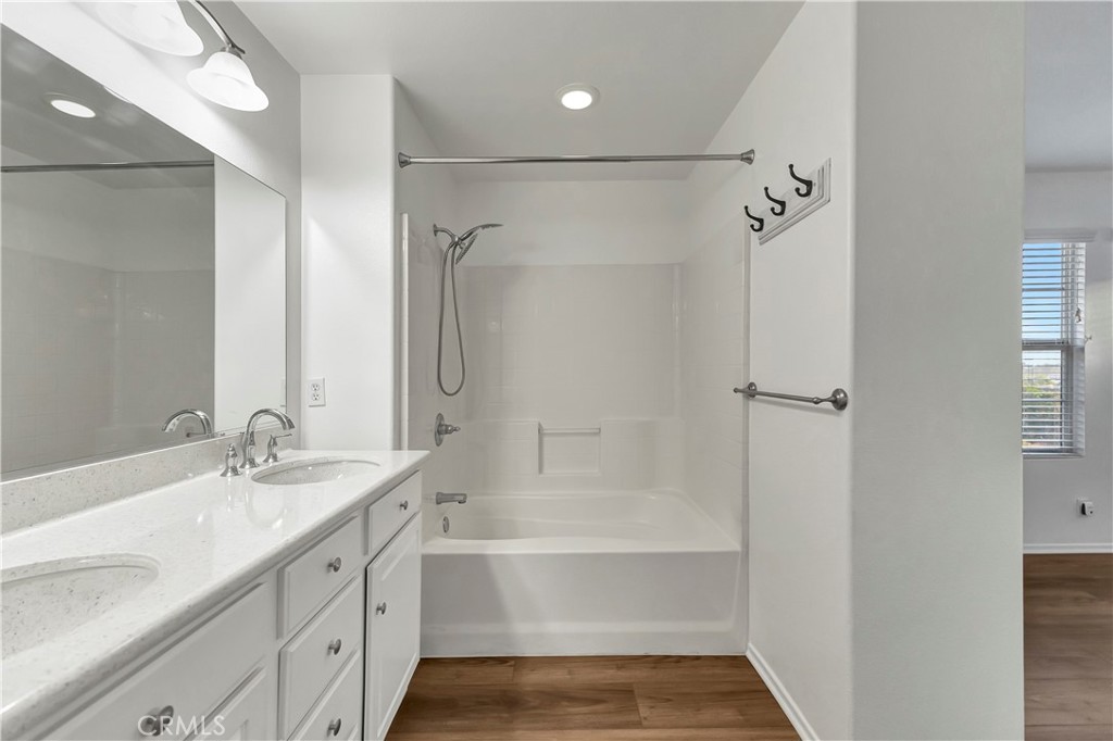 40 Three Vines Court Ladera Ranch, CA 92694 - Photo 22 of 28 a bathroom with a tub sink vanity granite and shower