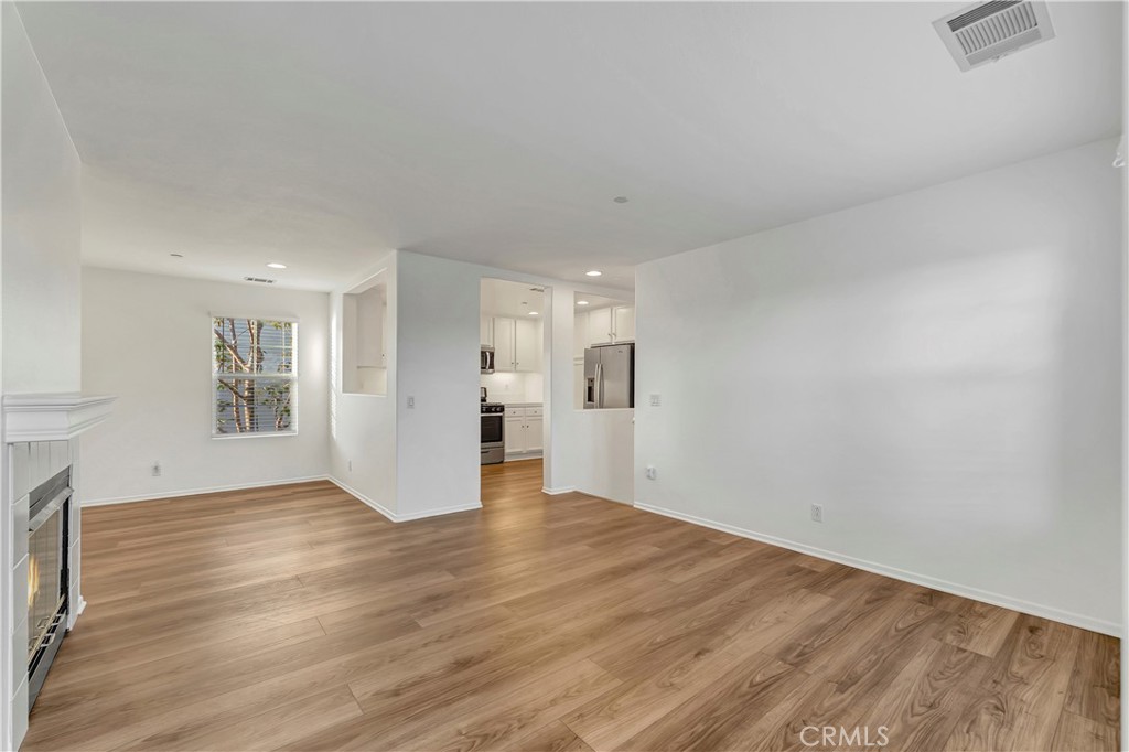 40 Three Vines Court Ladera Ranch, CA 92694 - Photo 5 of 28 a view of an empty room with wooden floor
