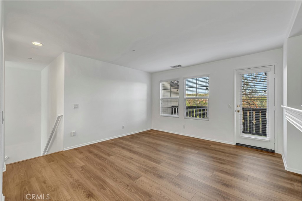 40 Three Vines Court Ladera Ranch, CA 92694 - Photo 6 of 28 a view of empty room with wooden floor and fan