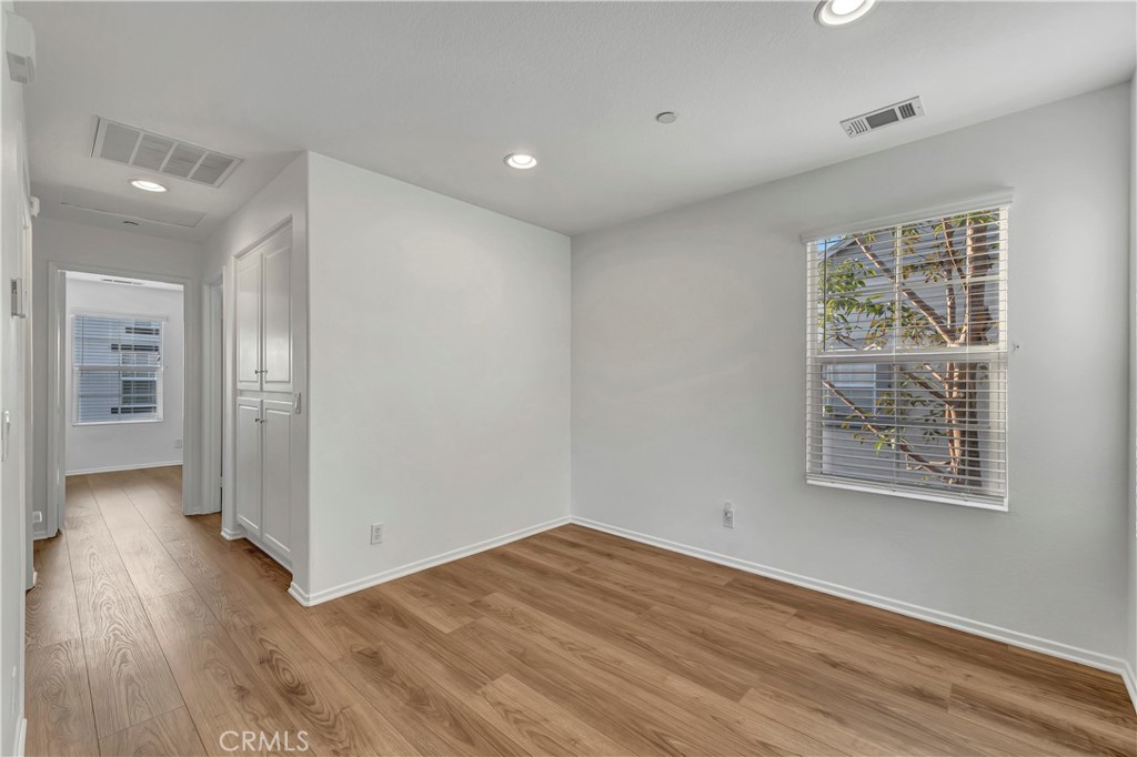 40 Three Vines Court Ladera Ranch, CA 92694 - Photo 7 of 28 a view of an empty room with wooden floor and a window