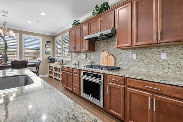 a view of a dining room with furniture and windows