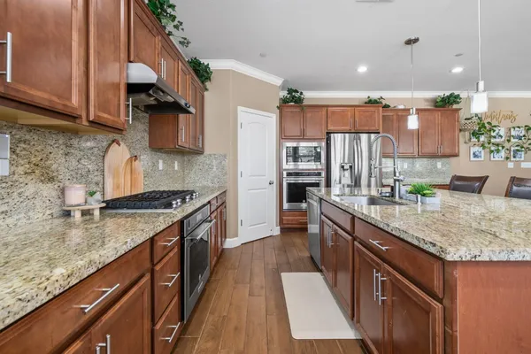 a bedroom with a bed couch and window