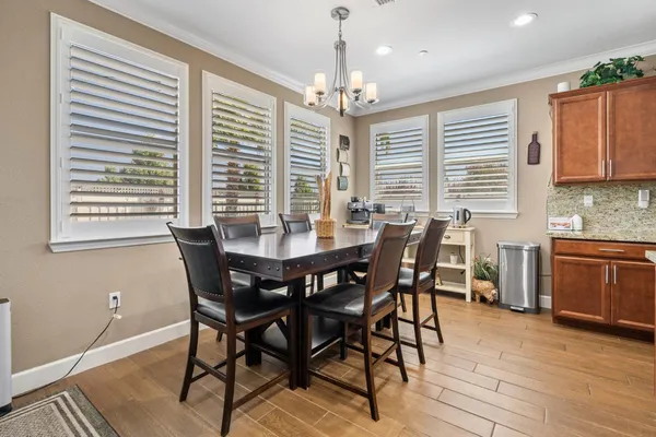 a view of a hallway with wooden floor and closet area