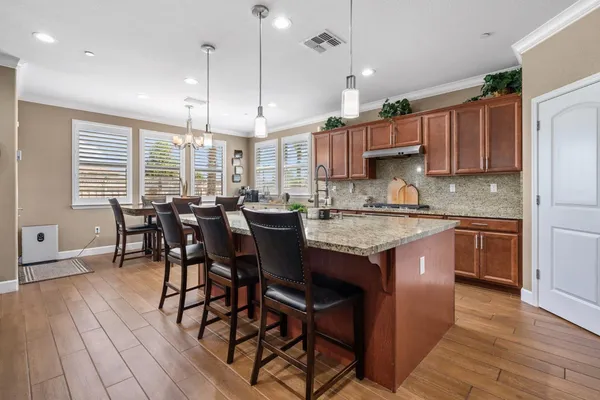 a bedroom with a bed a baby crib and a book shelf