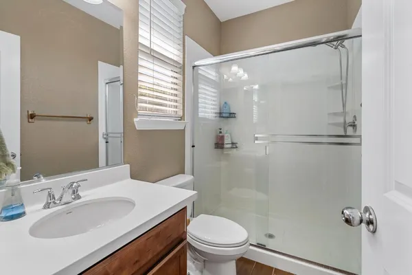 a bathroom with a sink double vanity mirror and a bathtub