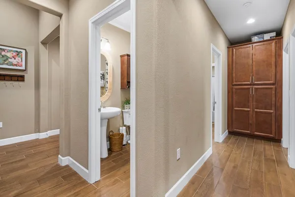 a bathroom with a tub shower and sink