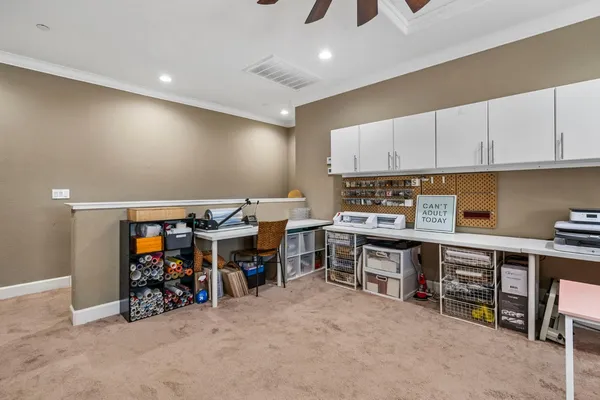 an aerial view of a house with a yard and a large pool