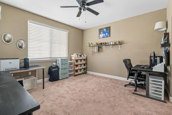 an aerial view of a house with a yard and outdoor seating