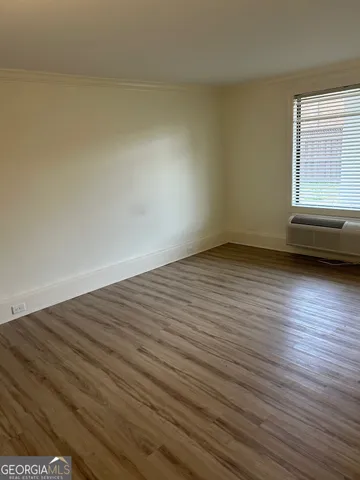 a view of an empty room and window
