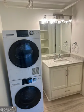 a bathroom with a sink mirror and vanity