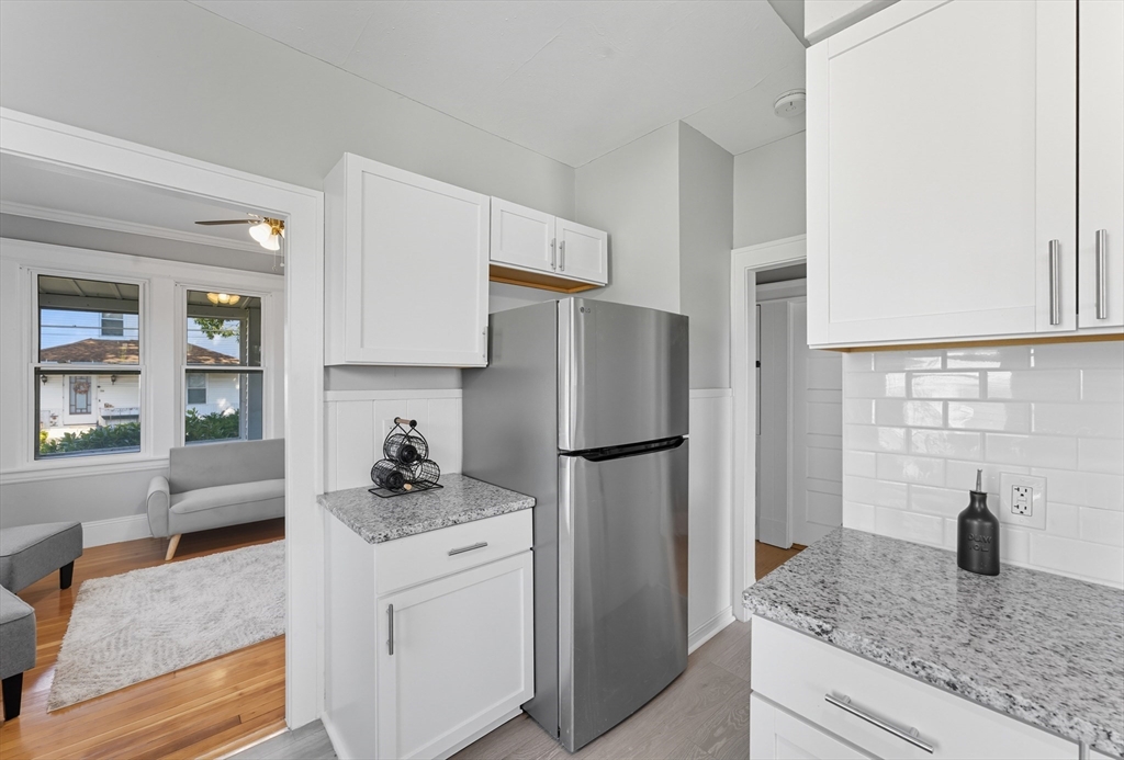 33 Taber Street Springfield, MA 01118 - Photo 12 of 39 a kitchen with refrigerator a washer and dryer