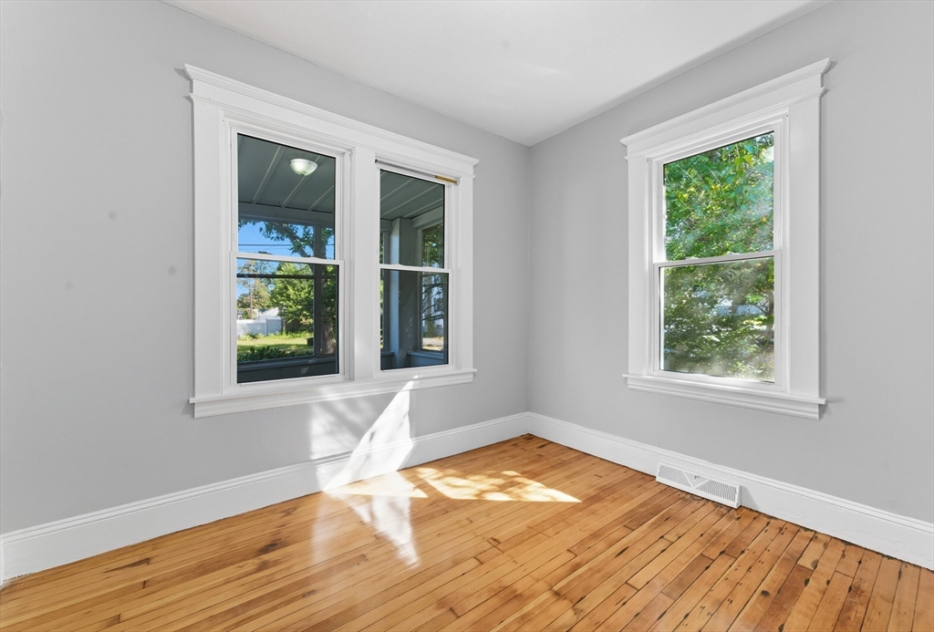 33 Taber Street Springfield, MA 01118 - Photo 17 of 39 a view of empty room with wooden floor and fan